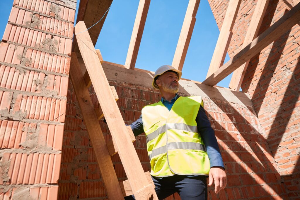 Inspector checking compliance with safety regulations at the construction site