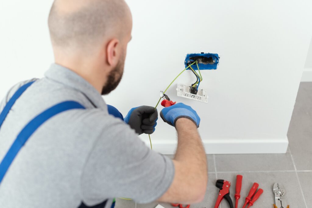 Professional electrician working on the electrical system